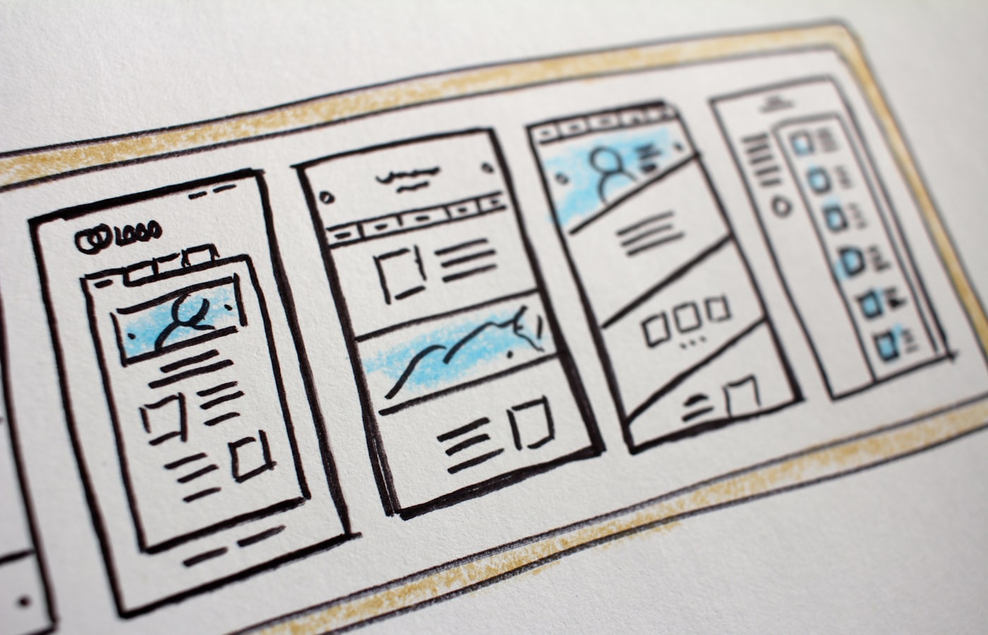 Hand-drawn mobile app wireframes from the first two weeks of design