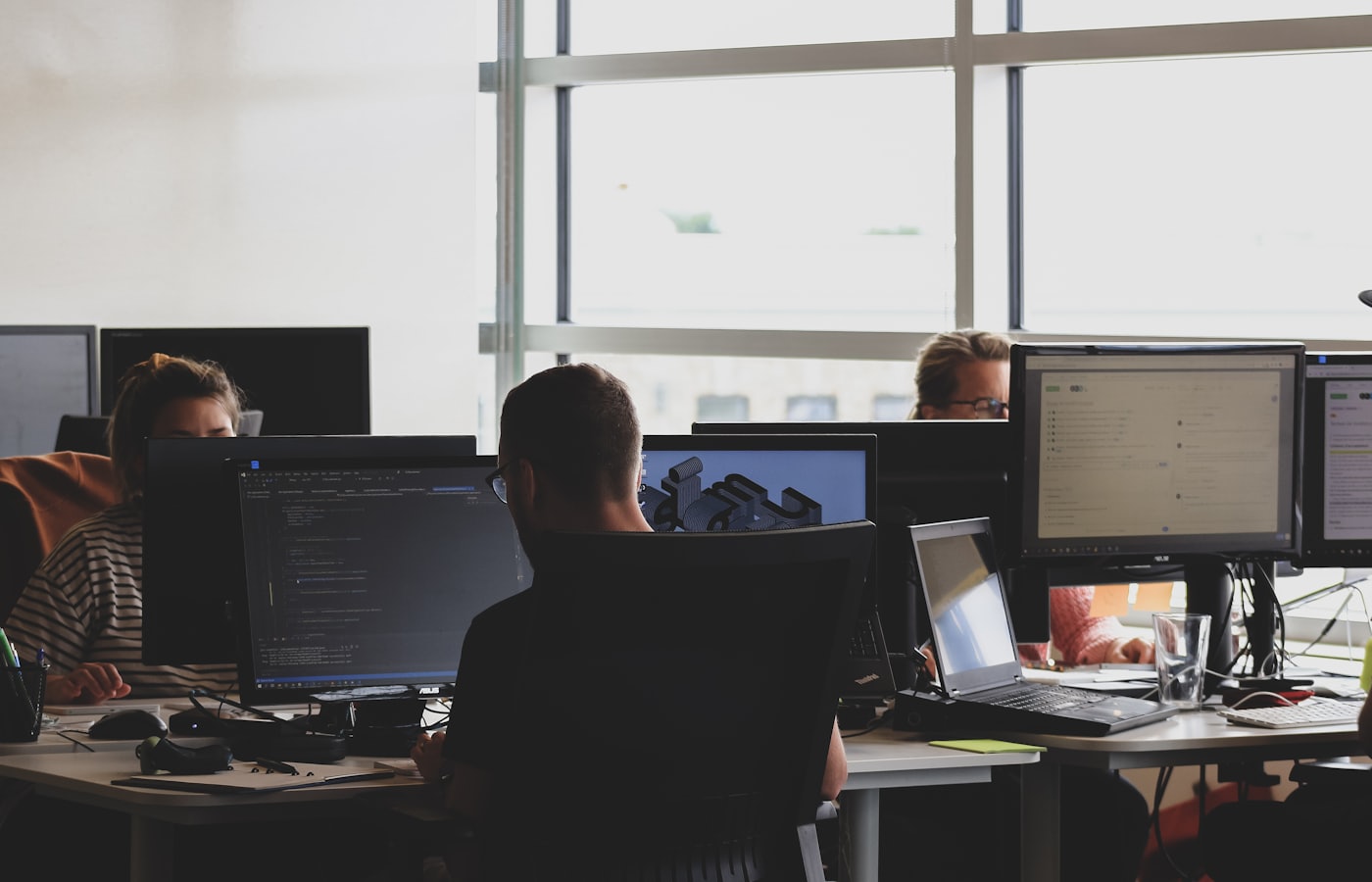 Experienced developers reviewing a mobile app build together