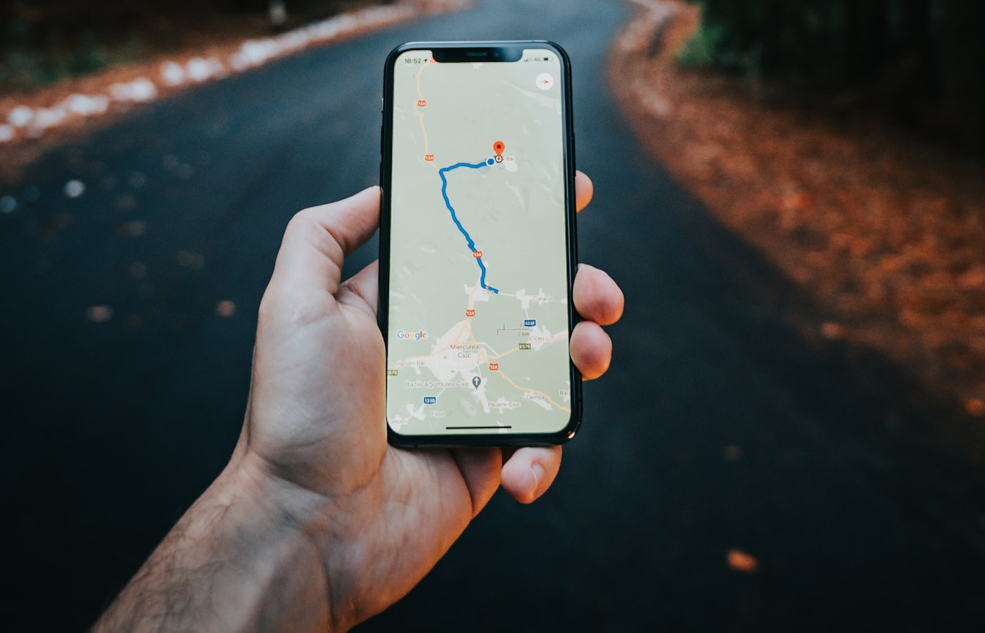 Customer using Google Maps on a phone to find a local business