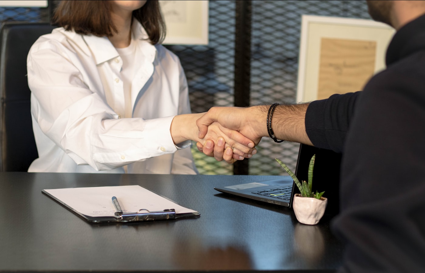 Two people shaking hands — finding a digital partner you can trust